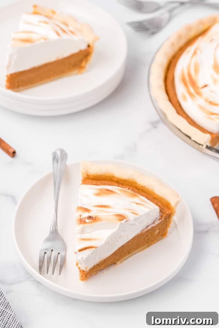 Top-down view of a whole Sweet Potato Pie with perfectly swirled, golden-brown maple marshmallow topping