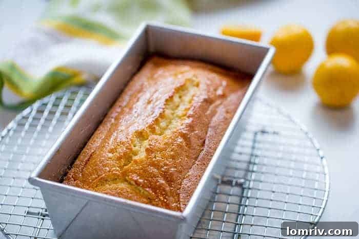 Close-up of a slice of Browned Butter Meyer Lemon Cake with glaze.