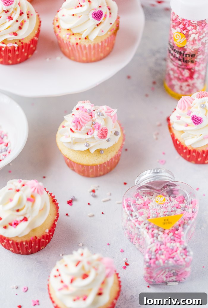 Tray of Vanilla Bean Buttermilk Cupcakes, beautifully frosted and ready to decorate