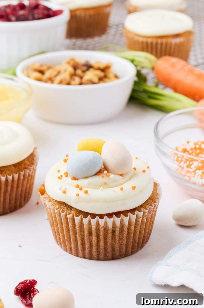 A beautifully decorated carrot cake cupcake, a perfect spring dessert.