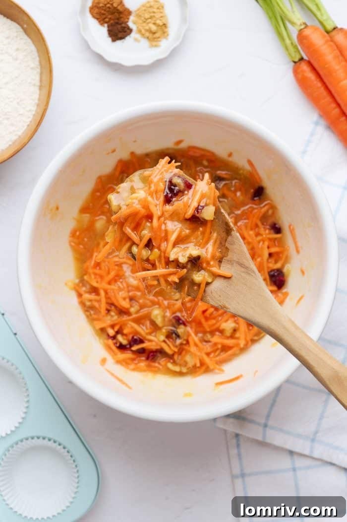 A mixing bowl with the wet ingredients, and a spoon showing the combined batter.