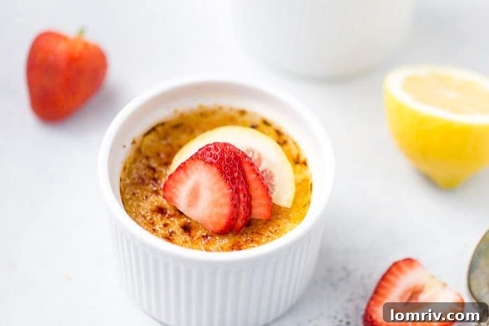 Close-up of a Lemon Creme Brulee, showing the smooth custard beneath a perfectly caramelized sugar crust.