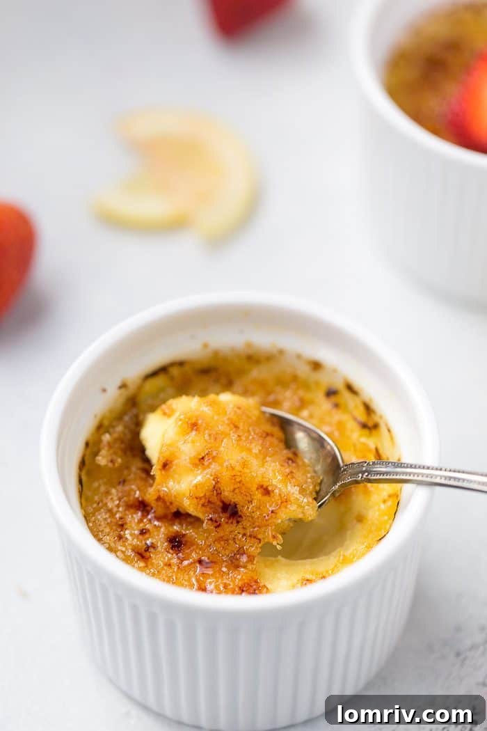 Three ramekins of Lemon Creme Brulee, garnished with fresh mint, ready to be served.