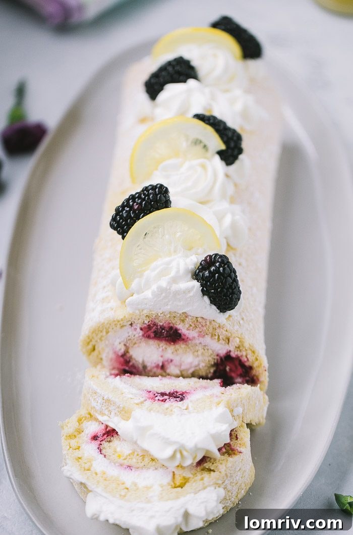 Blackberry Lemon Roll Cake with fresh blackberries and lemon zest