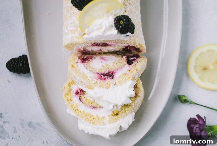 Cross-section of Blackberry Lemon Roll Cake showing filling