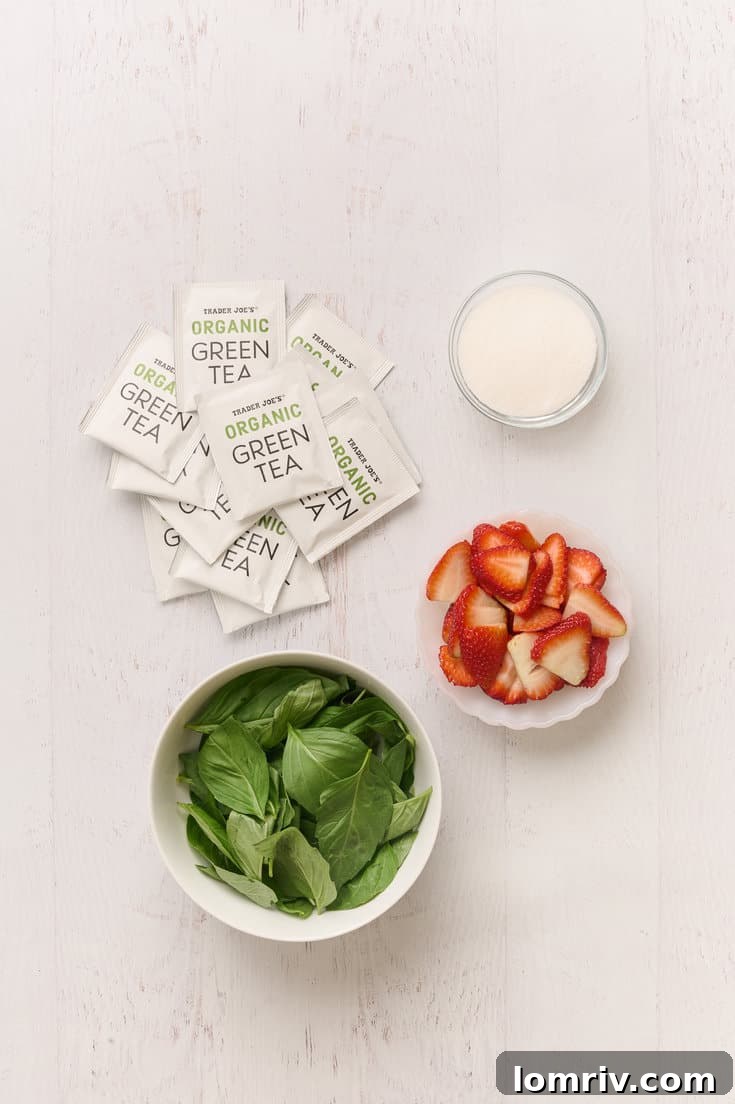 Ingredients for Strawberry Basil Iced Tea on a wooden board