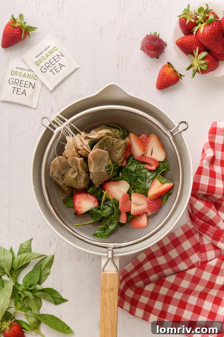 Pouring Strawberry Basil Iced Tea into a glass