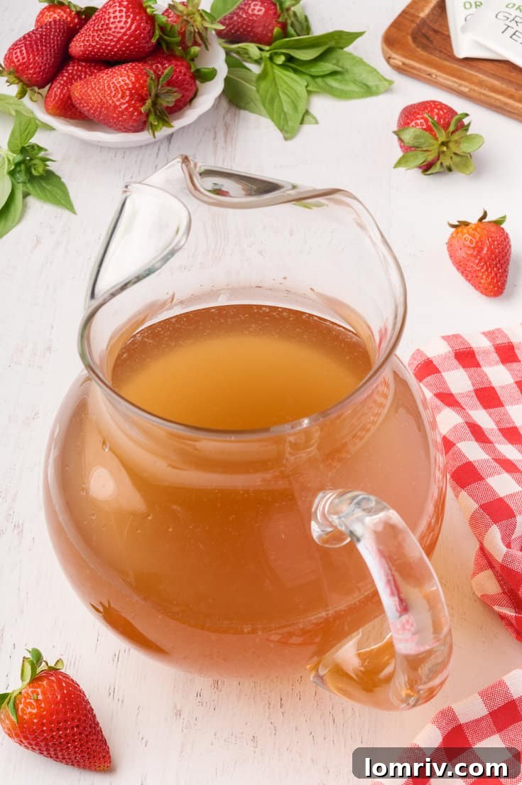 Glass of Strawberry Basil Iced Tea with garnishes