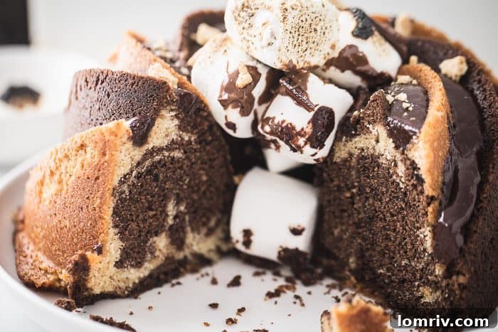 Stunning S'mores Bundt Cake with Melted Marshmallows and Ganache Drizzle