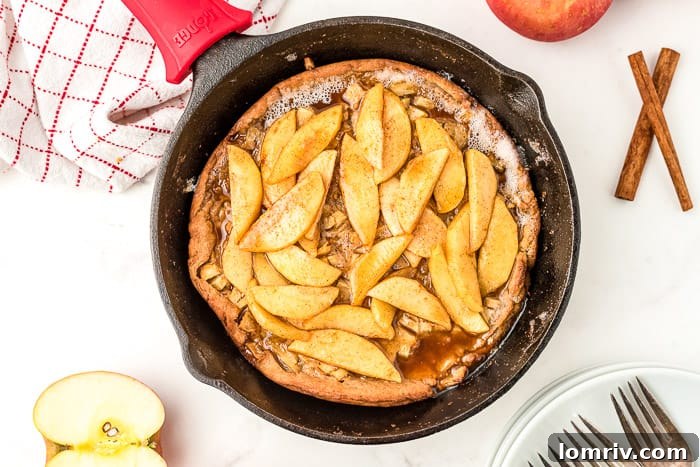 Close-up of a Caramel Apple Dutch Baby Pancake with whipped cream