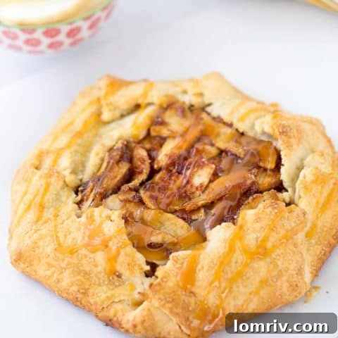 A beautifully rustic apple galette drizzled with homemade caramel sauce.