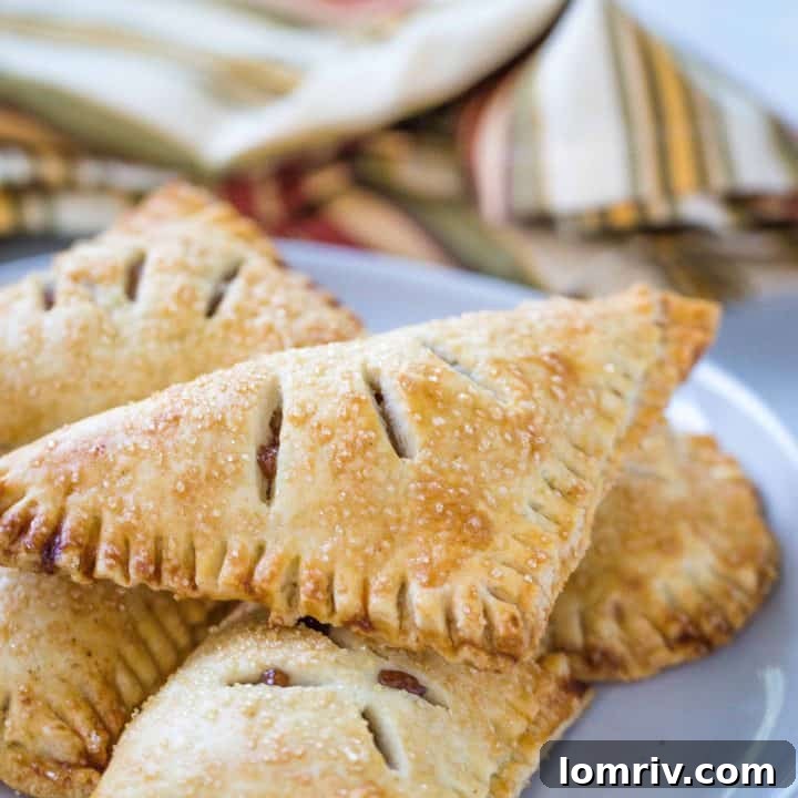 Golden brown classic apple hand pies with flaky crust.