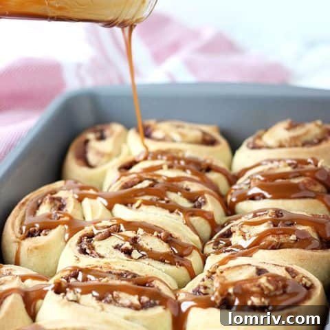 Warm salted caramel apple cinnamon rolls filled with spiced apples and pecans.