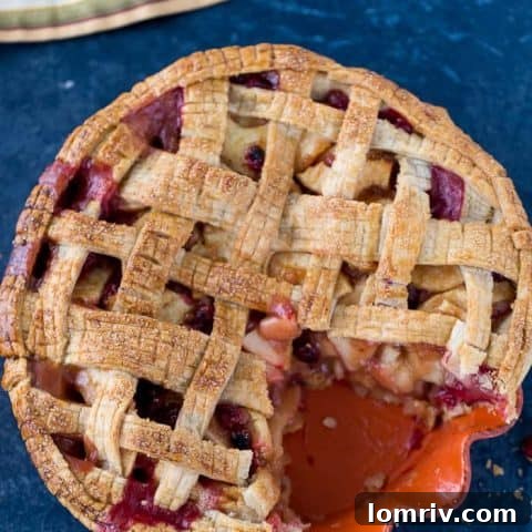A vibrant cranberry apple pie, balancing sweet and tart flavors.