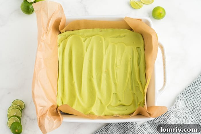 An overhead shot of freshly prepared Skinny Vegan Key Lime Pie Bars, arranged neatly on a cutting board, emphasizing their appealing presentation.
