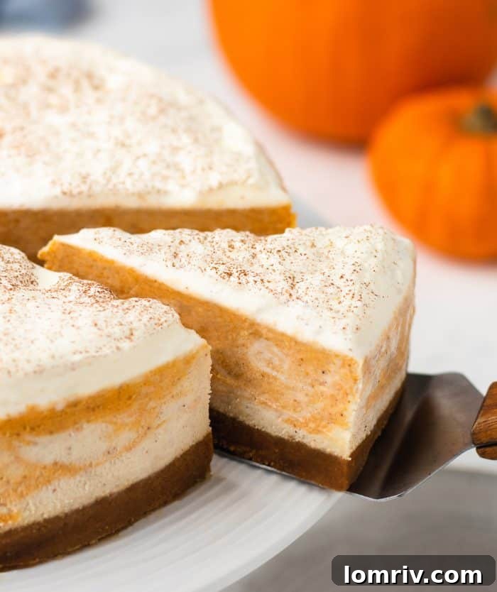 A closeup of a cheesecake with a slice being removed.