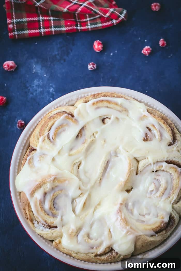 Closeup of Eggnog Cinnamon Rolls Drizzled with Extra Frosting