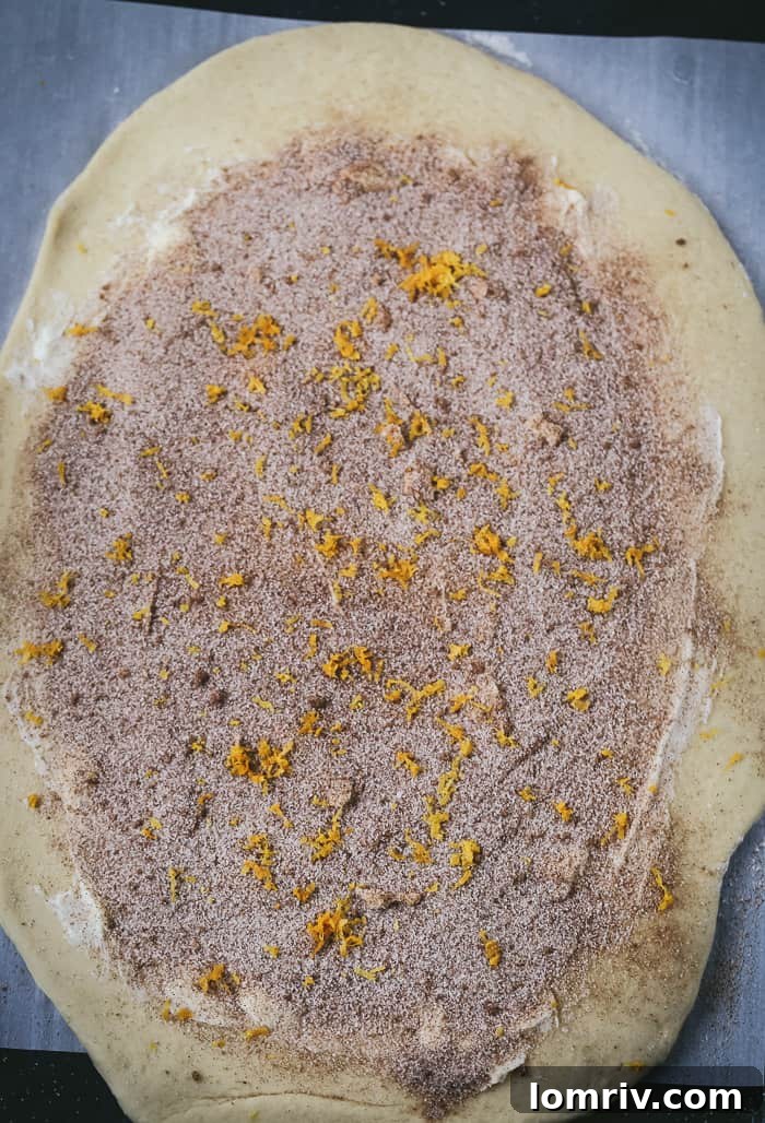 Adding Orange Zest to Eggnog Cinnamon Roll Filling