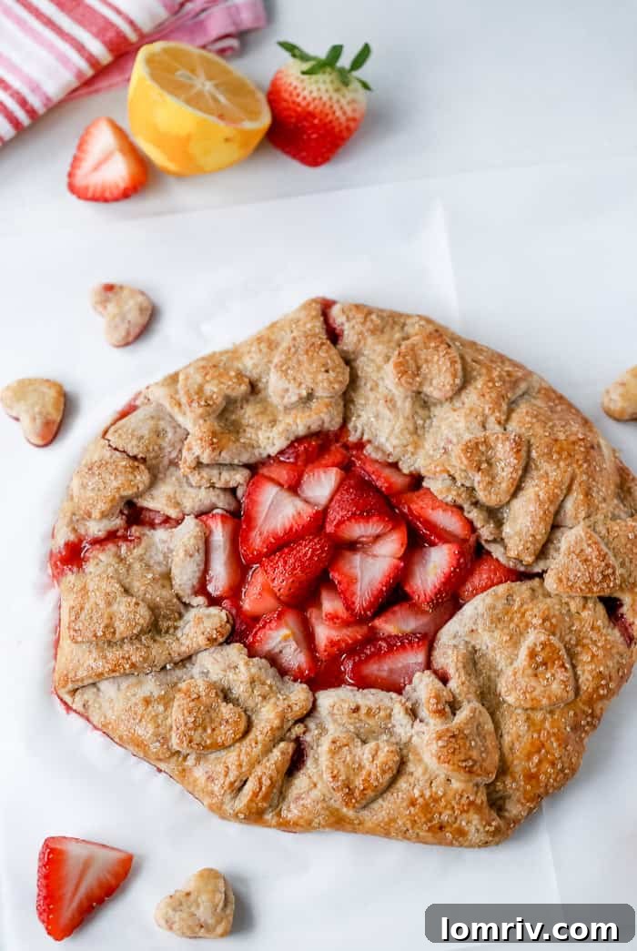 Homemade strawberry galette featuring a flaky, golden crust and sweet berry filling