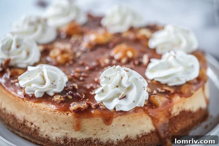 Close-up of a slice of Banana Foster Cheesecake, showing the creamy filling and crunchy crust