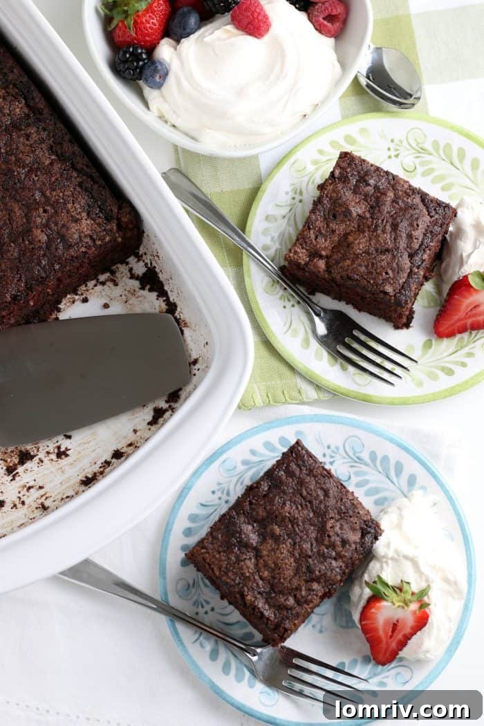 Full chocolate zucchini cake on a wire rack, cooling.
