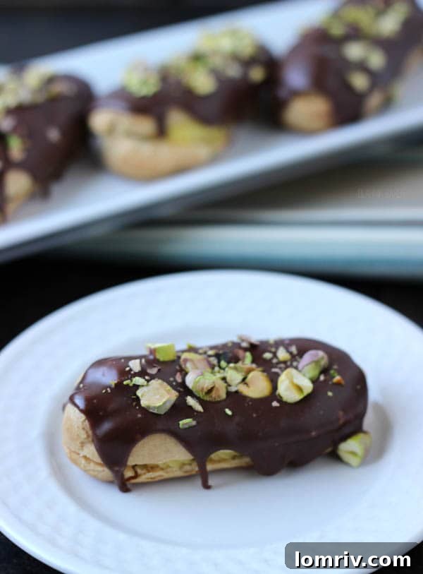 Chocolate Pistachio Éclairs on a serving plate