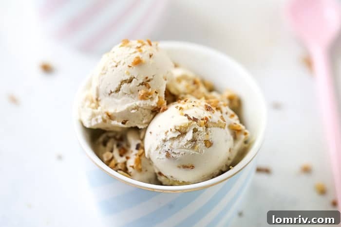 A small portion of Banana Walnut Cheesecake Ice Cream in a clear container, ready for sharing.