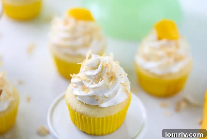 Delicious Mango Coconut Cupcakes with Fluffy Frosting