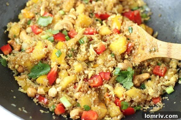 Close-up of Pineapple Cashew Quinoa Fried Rice with fresh cilantro