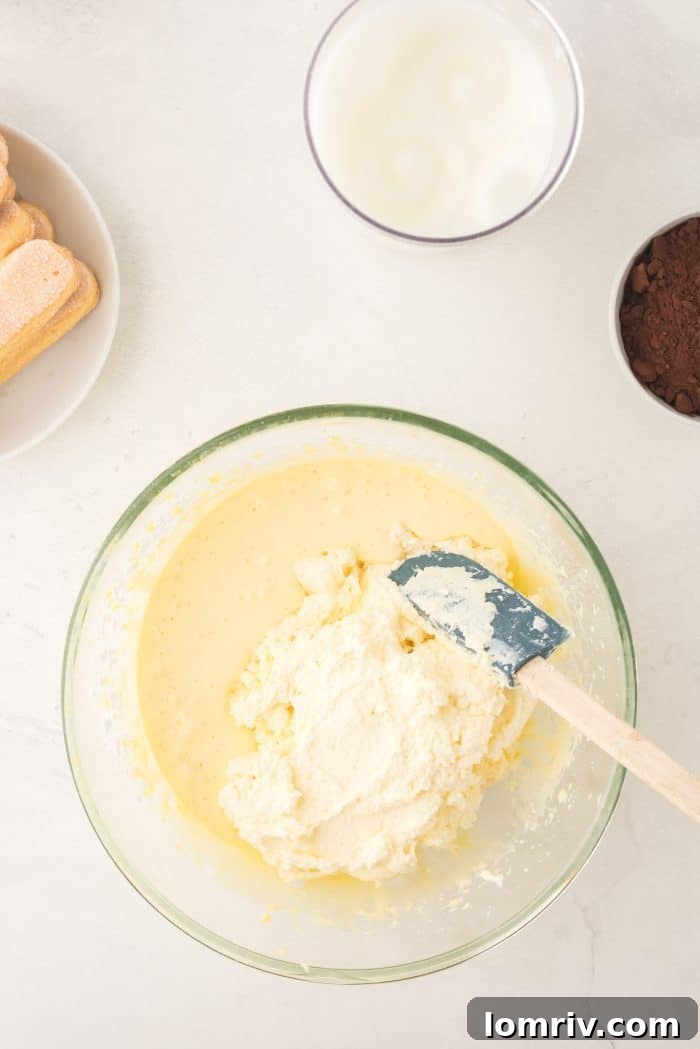 Mixing mascarpone cheese into egg yolk mixture