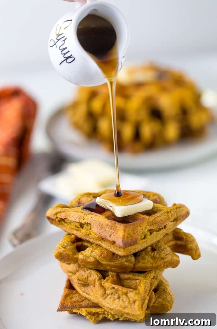 Buttermilk Pumpkin Waffles - A stack of freshly made pumpkin waffles, ready to be enjoyed.