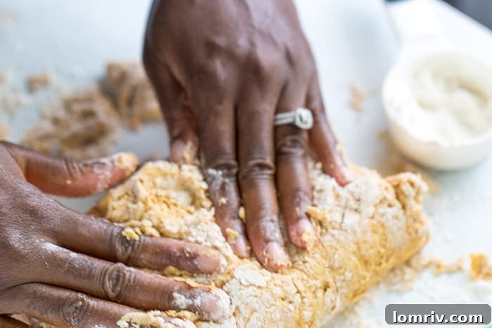 Turning pumpkin scone dough onto floured surface