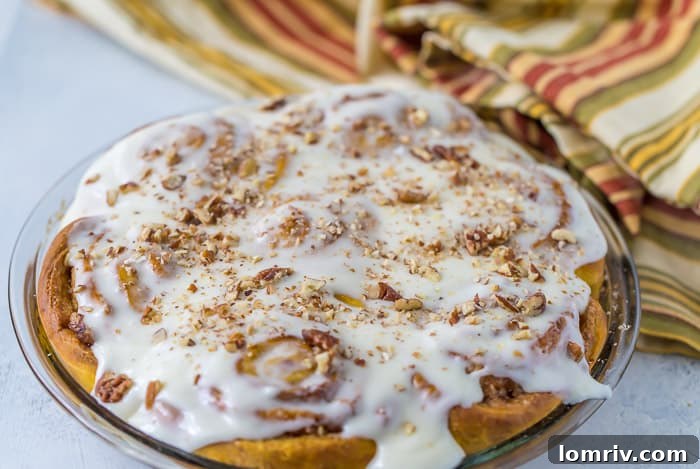 Close-up of freshly baked Pumpkin Cinnamon Rolls, ready for frosting
