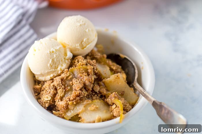 A final close-up image of the finished pear crisp, steam rising, ready to be served.