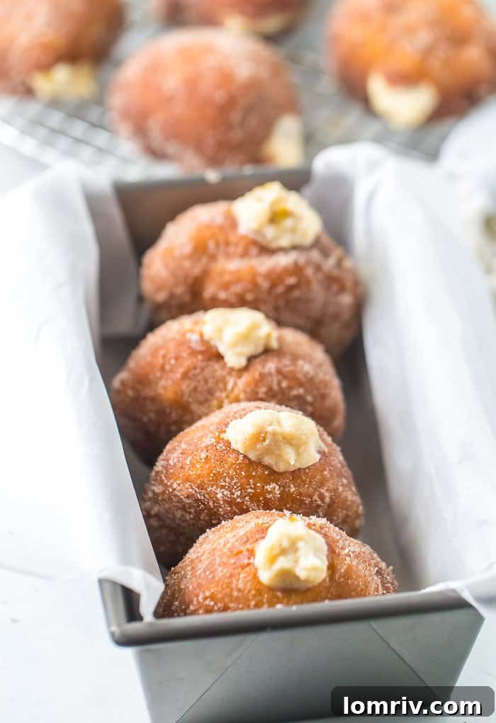 A plate of golden-brown Caramelized Pears and Mascarpone Donuts