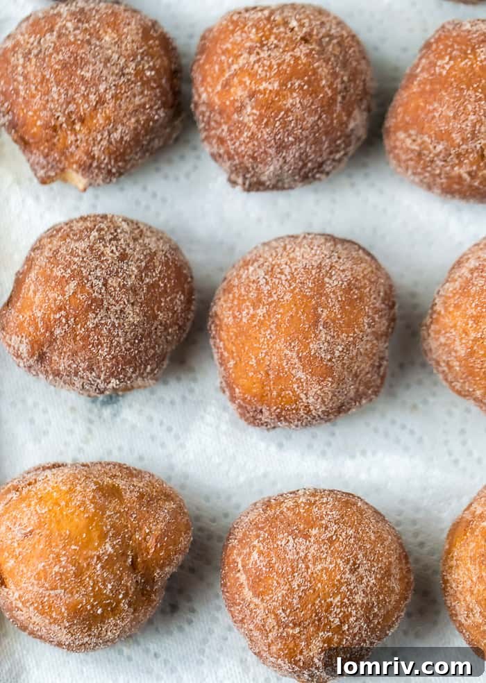A basket filled with freshly fried Caramelized Pears and Mascarpone Donuts
