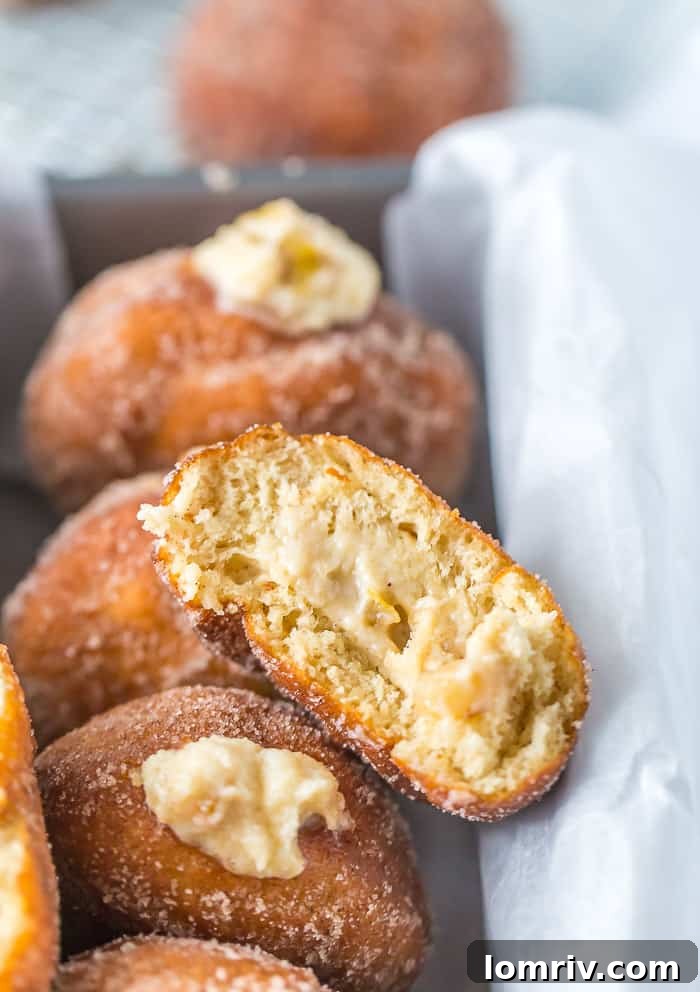 A stack of Caramelized Pears and Mascarpone Donuts with a light dusting of sugar