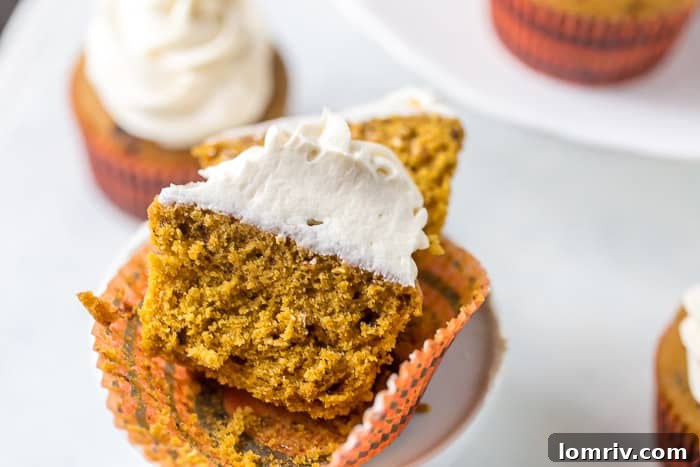 A beautiful arrangement of Pumpkin Spice Latte Cupcakes on a serving tray, perfect for sharing during the fall season.