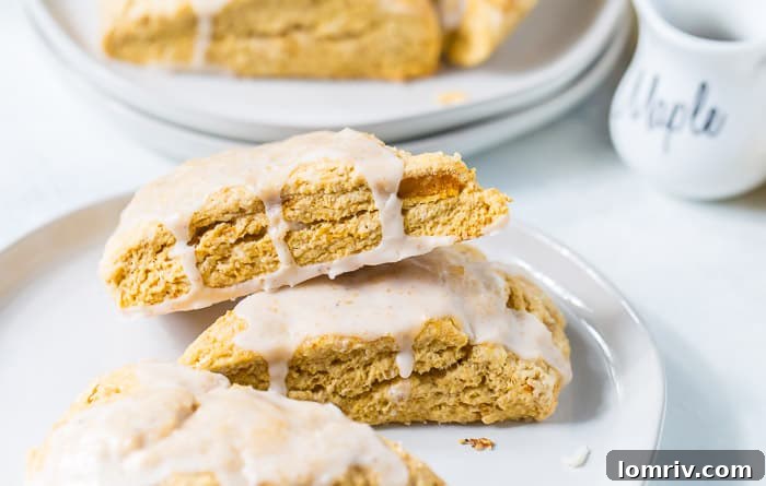 Individual sweet potato scone with a generous drizzle of maple icing