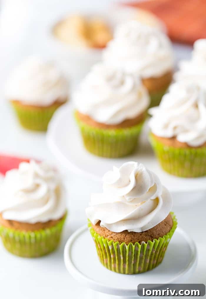 Delicious Apple Spice Cupcakes with Cinnamon Frosting arranged beautifully