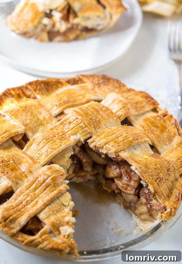 Unbaked Pear Apple Pie with a decorative lattice top, ready for the oven