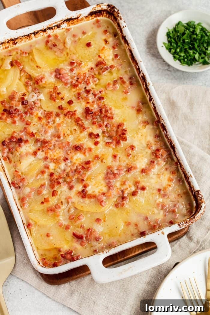Classic Scalloped Potatoes recipe, featuring thinly sliced potatoes baked in a rich, cheesy sauce for the ultimate comfort food experience.