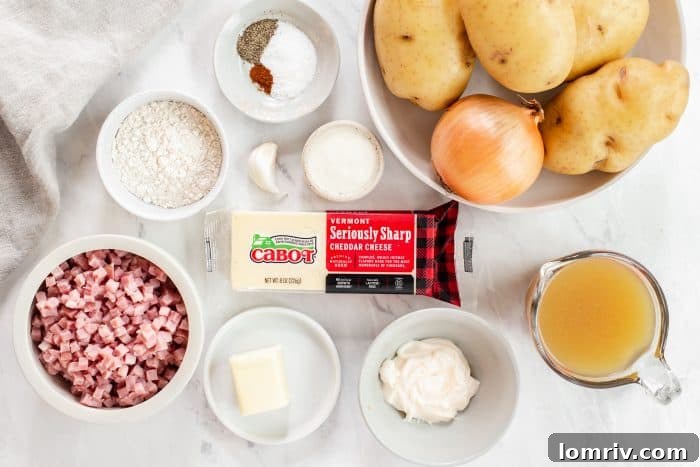 The creamy, cheesy sauce for Grandpa's Scalloped Potatoes, made with butter, flour, broth, Cabot cheddar, mayonnaise, and ranch seasoning, simmering on the stovetop.