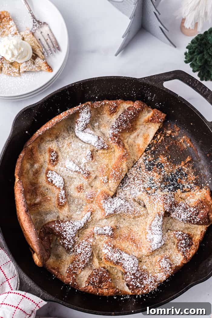 A fully baked Gingerbread Dutch Baby Pancake, golden and ready to be served
