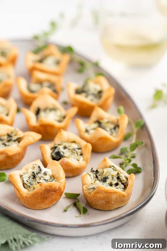 Spinach Artichoke Dip Bites in a mini muffin pan