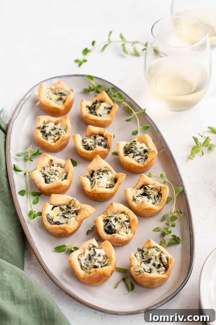 Spinach Artichoke Dip Bites arranged on a platter