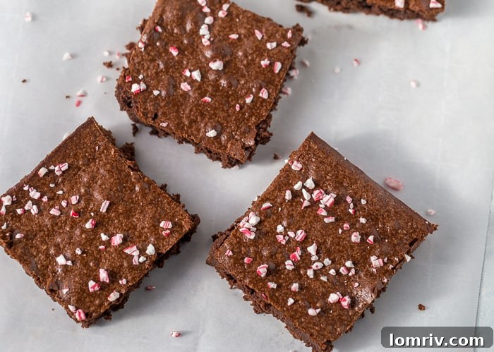 Mixing brownie batter with a spatula in a bowl