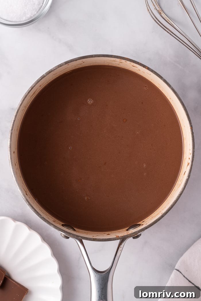 Mug of homemade hot chocolate being poured