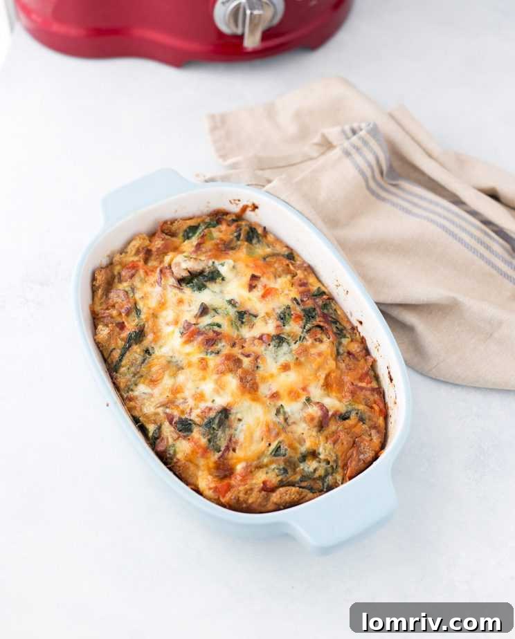 Delicious Breakfast Casserole with bacon, sausage, cheese, and vegetables