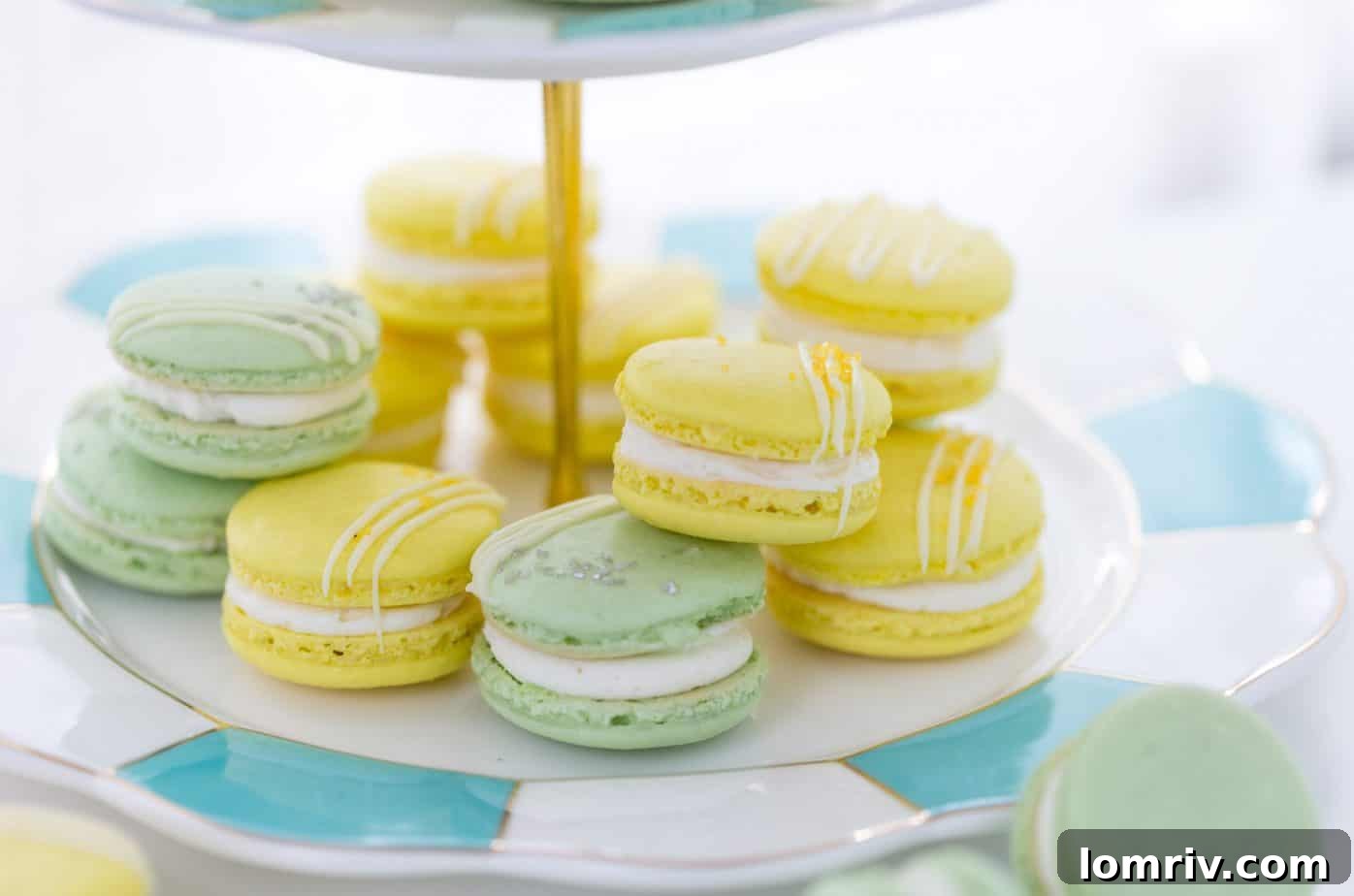Bright and colorful Lemon Lime Macarons stacked neatly, showcasing their delicate shells and creamy filling.